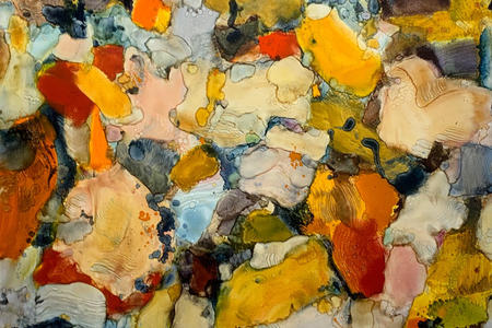 an abstract painting with splotches in multicolors