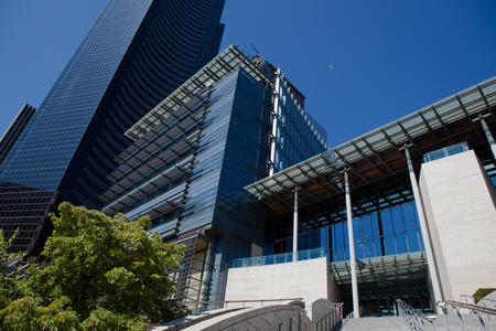 the exterior of seattle city hall. the sky is blue. 