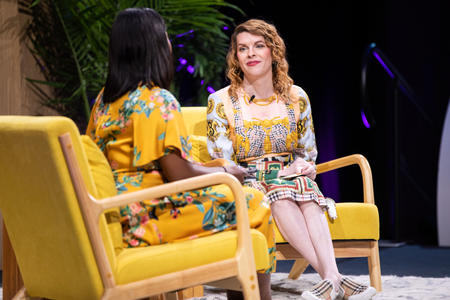 Two women on stage talking