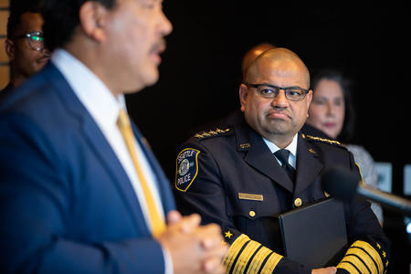 the mayor of seattle stands next to the chief of police